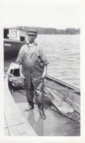 Bill Schram and his fishing boat the Eclipse. Courtesy of the Leelanau Historical Society
